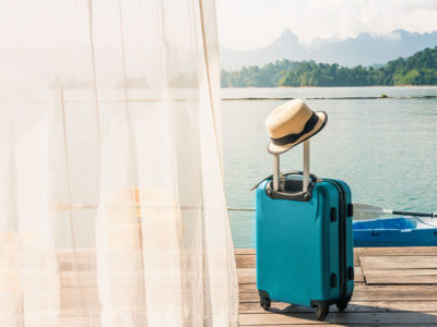 mobile-billboard-suit-case-tropical Suit Case on the dock of a tropical vacation